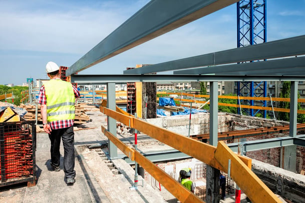 Construction of a modern building and a skyscraper smaller sized