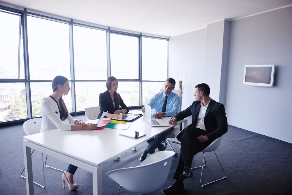 people sat around a large table