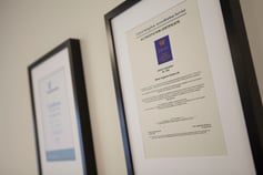 two certificates hangning on the wall